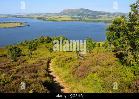 Path leading up to viewpoint on Benarty Hill with view across Loch Leven to the Lomond Hills, Perth and Kinross, Scotland Stock Photo