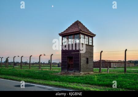 OSWIECIM, POLAND - JULY 29, 2017: Watchtower in the concentration camp Auschwitz Birkenau in Oswiecim, Poland. Stock Photo