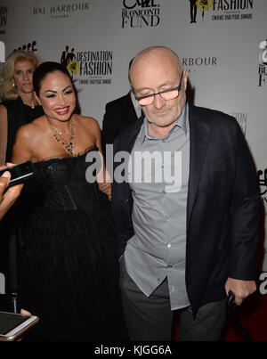 BAL HARBOUR, FL - MARCH 05:  Rock Legend Phil Collins seems to be in pain as he hobbles down yet another red carpet in Miami with wife Orianne Collins they both look in pain as they make their way down the carpet with the assistance of canes as they attend The Buoniconti Fund To Cure Paralysis on March 5, 2016 in Miami, Florida   People:  Phil Collins, Orianne Collins Stock Photo