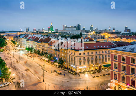 Main old street called Krakowskie Przedmiescie and modern office buildings in the downtown, Warsaw, Poland Stock Photo