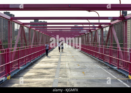 New York City - July 12, 2015: The pedestrian walkway for the Williamsburg Bridge connecting Brooklyn to Manhattan. Stock Photo