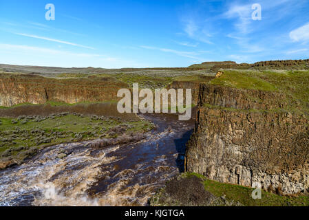 Muddy Palouse River running full strength above Palouse Falls. March 19, 2017. Stock Photo