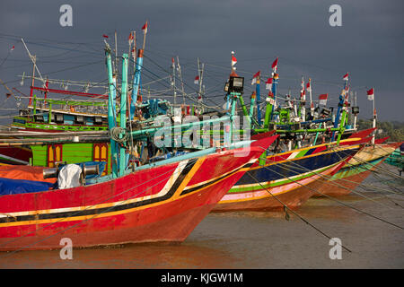 Colourful traditional Indonesian fishing boats in the port at Jepara, Central Java, Indonesia Stock Photo