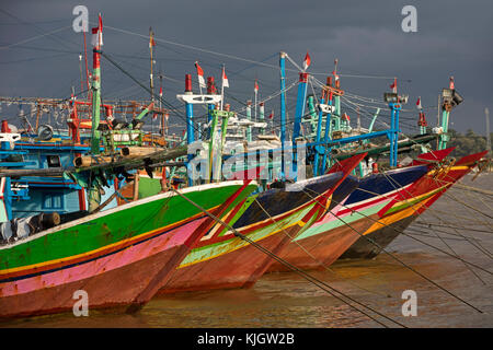 Colourful traditional Indonesian fishing boats in the port at Jepara, Central Java, Indonesia Stock Photo