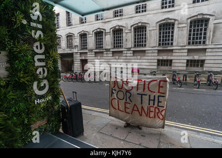 November 24, 2017 - London, UK. 24th November 2017. Victimised cleaner Beatriz Acuna holds a banner 'Justice For the Cleaners outside 138 Fetter Lane, one of the offices where she worked for Regular Cleaning Limited, a family business based in Lewisham., The Cleaners and Allied Independent Workers Union (CAIWU) was protesting on her behalf as she has been sacked by Regular without cause because of her trade union activities as a rep at One Finsbury Circus where she had worked for three years. The protesters at Fetter Lane were told there was nobody on site from either the management company. Stock Photo