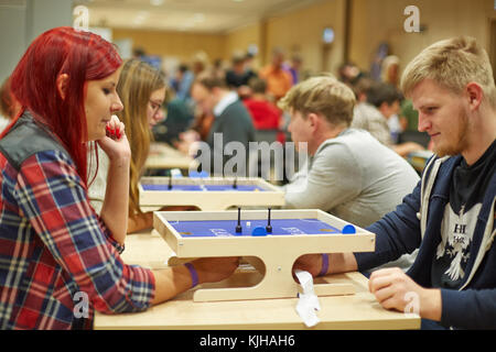 Riga, Latvia. 25th Nov, 2017. Ready, set, throw the dice - board game enthusiasts from the Baltic States have gathered in Riga, Latvia, 25 November 2017. More than 130 'The Settlers of Catan' players from Estonia, Latvia and Lithuania searched for the champion for the popular German board game at Latvia's national library. Credit: Alexander Welscher/dpa/Alamy Live News Stock Photo
