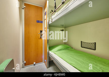 Train berth indoor with two beds. Travel background. Horizontal Stock Photo
