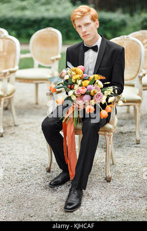 groom with flowers Stock Photo