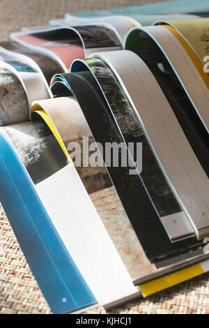 Many opened journals. Sun light. Stock Photo