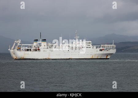 USNS Zeus (T-ARC-7), a Zeus-class cable laying and repair vessel operated by the US Navy, off Gourock on an inbound journey to the Faslane naval base. Stock Photo