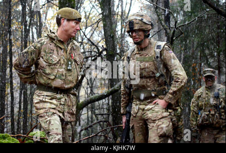 Despite the snow, Brig. Gen. Zac Stenning (Lft), Commander, 1st Mechanized Brigade, British Army, stops by to visit with British soldiers with the 1st Battalion, Royal Regiment of the Fusiliers training at the U.S. Army's Joint Multinational Readiness Center in Hohenfels, Germany, as they participate in Allied Spirit VII, 12 Nov. 2017. Approximately 4,050 service members from 13 nations are participating in exercise Allied Spirit VII at 7th Army Training Command’s Hohenfels Training Area, Germany, Oct. 30 to Nov. 22, 2017. Allied Spirit is a U.S. Army Europe-directed, 7ATC-conducted multinatio Stock Photo