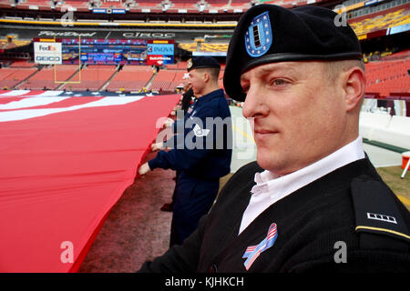 D.C.-area service members participate in the Washington Redskins Salute to  Service match-up against the Minnesota Vikings at FedEx Field on Nov. 12.  The event required 107 service members alone to unveil a