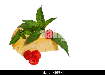 Cheesecake with mint leaves and whole raspberry berries. Isolated on white background. Stock Photo