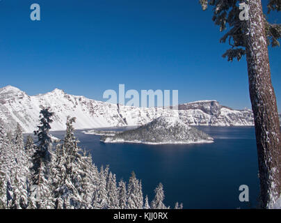 Fresh early winter snow on Wizard Island in Crater Lake, Oregon. Stock Photo