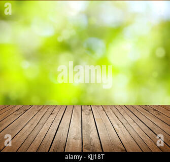Empty wooden table nature bokeh background with a country outdoor theme ...