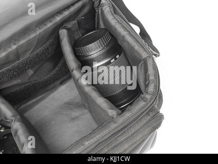 black camera bag on open, have camera lens white background , select focus Top view Stock Photo