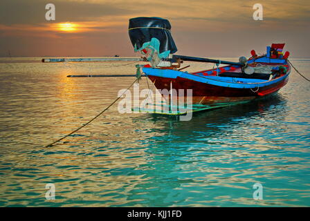 Colorful traditional fishing boat on the sea in Thailand Asia at sunset in Koh Tao, Koh Phangan, Koh Samui island seascape Stock Photo