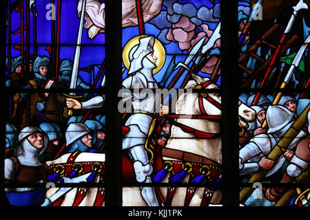 Auxerre cathedral dedicated to Saint Stephan.  Stained glass window.  Joan of Arc (Jeanne d'Arc) is considered a heroine of France for her role during Stock Photo