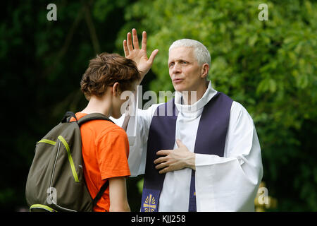 Confession at the FRAT catholic youth camp. France. Stock Photo