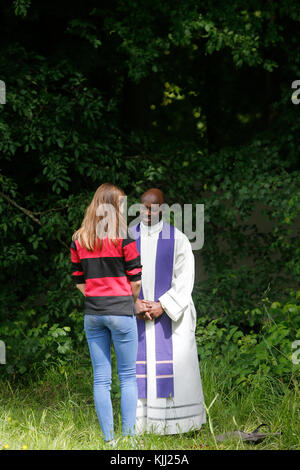 Confession at the FRAT catholic youth camp. France. Stock Photo