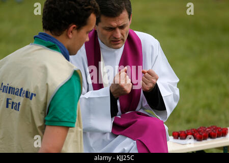 Confession at the FRAT catholic youth camp. France. Stock Photo
