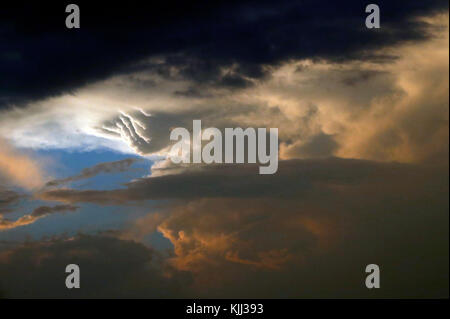 Dramatic clouds in the sky during sunset.  Kenya. Stock Photo