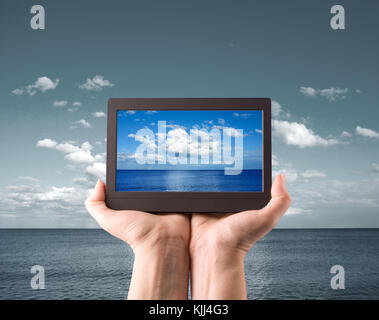 hands holding computer laptop smart phone tablet and touch pad Stock Photo