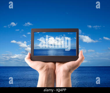 hands holding computer laptop smart phone tablet and touch pad Stock Photo