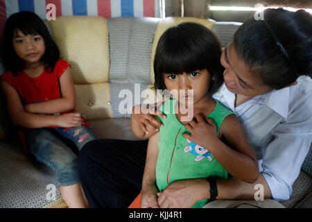 Franciscan sister of Mary visiting a poor family. Stock Photo