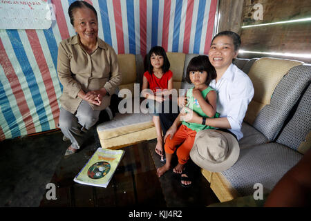 Franciscan sister of Mary visiting a poor family. Stock Photo