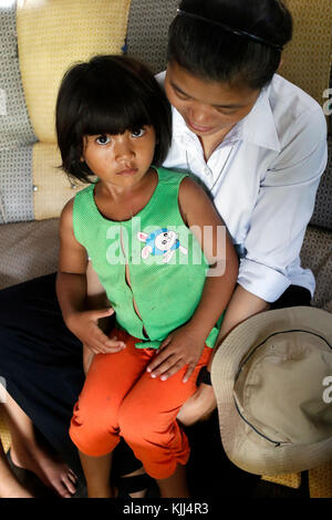 Franciscan sister of Mary visiting a poor family. Stock Photo