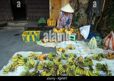 Vietnamese woman selling fresh bananas in the street.  Hoi An. Vietnam. Stock Photo