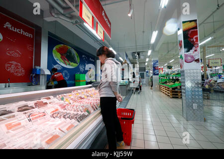 Auchan supermarket.  Woman shopping.  Ho Chi Minh City. Vietnam. Stock Photo