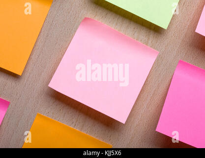 Reminder notes on the bright colorful paper close up Stock Photo
