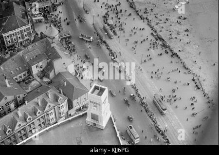 1940s view from the top of the Blackpool Tower in England.Blackpool Tower is a tourist attraction in Blackpool, Lancashire, England, which was opened to the public on 14 May 1894. Inspired by the Eiffel Tower in Paris, it is 518 feet (158 metres) tall and is the 120th tallest freestanding tower in the world. Blackpool Tower is also the common name for Tower buildings, an entertainment complex in a red-brick three-storey block comprising the tower, the ground floor aquarium and cafeteria, Tower Circus, the Tower Ballroom and roof gardens that was designated a Grade I listed building in 1973. Stock Photo