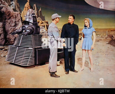FORBIDDEN PLANET 1956 MGM science fiction film with from left:  Robby the Robot, Leslie Nielsen, Walter Pigeon, Anne Leslie Stock Photo