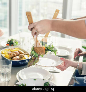 Women having dinner together Stock Photo