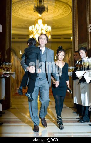 BUCHAREST, ROMANIA - OCT 31:  Actor Nicolas Cage, Alice Kim Cage and son Kal-El at The Halloween Ball of the Parliament Palace in Bucharest.  on October 31, 2010 in Bucharest, Romania  People:  Nicolas Cage Alice Kim Cage Kal-E Stock Photo