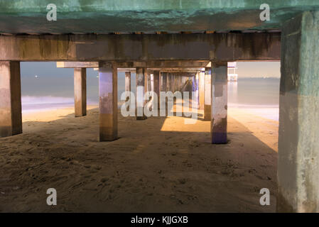 Underside of pier at night in Coney Island Brooklyn, long time exposure Stock Photo