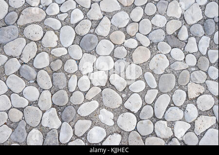 Textured gray stone pebble abstract background Stock Photo
