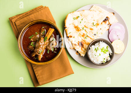 Mutton Masala Or Masala Gosht or indian lamb rogan josh with some seasoning, served with Naan or Roti, selective focus Stock Photo