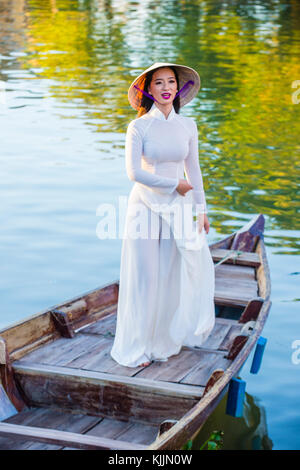 Vietnamese woman wearing Ao Dai dress during the Mid autumn festiaval in Hoi An ,Vietnam Stock Photo