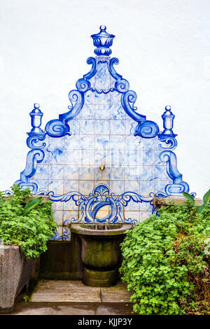 Stone drinking fountain decorated with Portuguese azulejos tiles, Funchal Old Town, Madeira, Portugal Stock Photo
