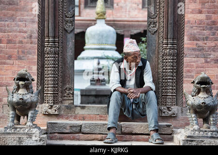 Sitting on the steps, Kathmandu, Nepal Stock Photo