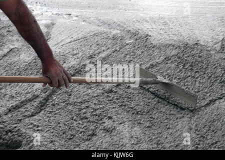 Construction site. Worker pouring concrete.  France. Stock Photo