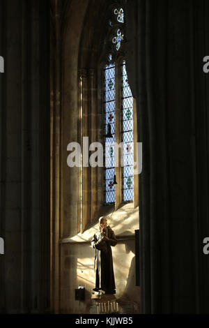 Notre Dame church, Dives sur Mer. St Anthony statue. Stock Photo