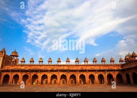 Fatehpur Sikri, founded in 1569 by the Mughal Emperor Akbar, served as the capital of the Mughal Empire from 1571 to 1585.  Surrounding wall of the Ja Stock Photo