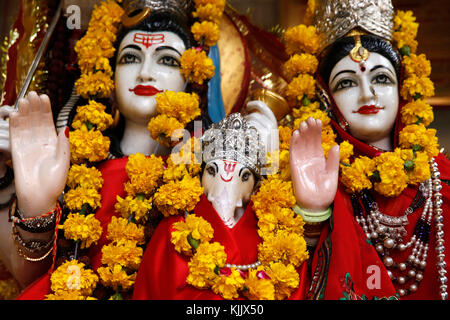 Shiva, Parvati and Ganesh murthis (statues) in a Delhi hindu temple. Delhi.  India. Stock Photo