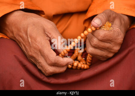 Tibetan monk holding prayer beads. Nepal. Stock Photo
