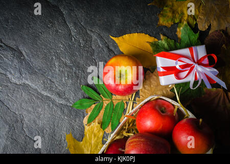 Homemade nice background of autumn apples, honey and walnuts. Black stone background. View from above. place for text. Copy space. Stock Photo